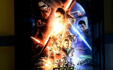 A poster is shown to promote the new hit 'Star Wars: The Force Awakens' at Regal Cinemas in Union Square on December 17, 2015 in New York City.