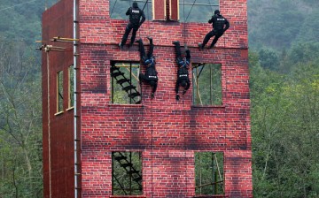 Special police attend an anti-terrorism drill in Taizhou, Zhejiang Province, on Nov. 20, 2015. 