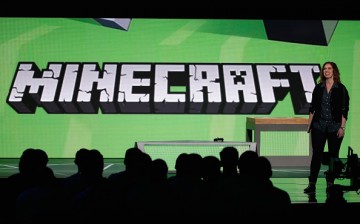 A Mojang executive explains some Minecraft update at a conference.