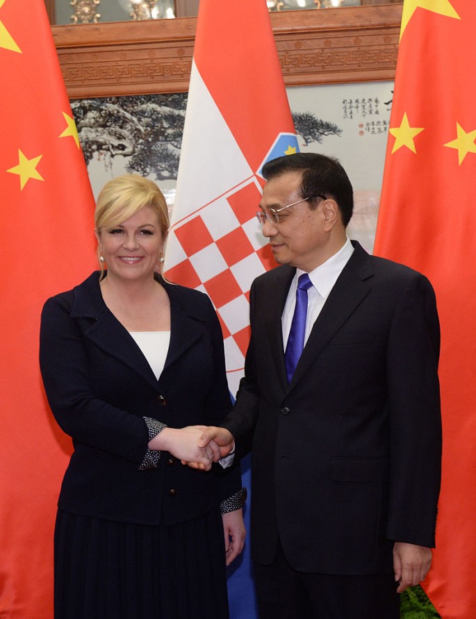 BEIJING, CHINA - OCTOBER 15: Chinese Premier Li Keqiang (right), shakes hands with Croatian President Kolinda Grabar-Kitarovic before their meeting at the Great Hall of the People on October 15, 2015 in Beijing, China. (Photo by Parker Song-Pool/Getty Images)