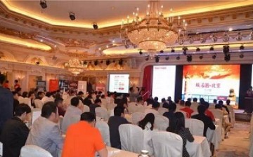 Investors and businessmen attend a domain name auction in Beijing in May.