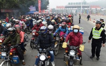 Many migrant workers prefer to use motorcycles as their mode of transport when they go home to their families in the provinces for the Chinese New Year.