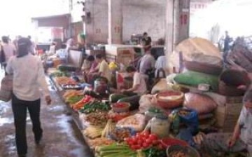 Vendors sell agricultural produce in a market in Fuli, a town in Fuchuan County certified as an international slow city by Cittaslow.