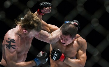 China's Wang Sai (R) and England's Danny Mitchel during their welterweight fight in a 2014 UFC Fight Night held at The Venetian Macao Cotai Arena in Macau. UFC and Sina Sports have now partnered to bring live streaming fights in China.