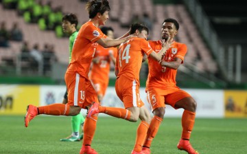 Shandong Luneng players celebrate a goal during last season's AFC Champions League qualifiers.