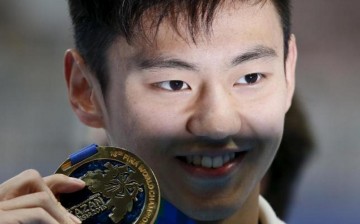 Ning Zetao of China poses with his gold medal after winning the men's 100m freestyle final at the Aquatics World Championships in Kazan, Russia, Aug. 6, 2015. 