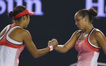China's Shuai Zhang (L) shakes hands with the United States' Madison Keys after their fourth round match during day eight of the 2016 Australian Open.