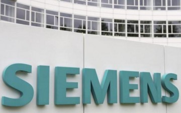 A Siemens logo is pictured on an office building of Siemens AG in Munich, May 30, 2014. 