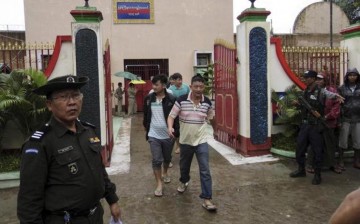 Chinese nationals, who were jailed for illegal logging, walk out of Myitkyina prison after being released during an amnesty in Myitkyina, the capital of Kachin State, north of Myanmar, July 30, 2015.