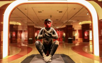 The wooden sculpture, Black Monkey, from the Qing Dynasty (1636-1912) stands in the center of the exhibition hall, greeting visitors with a 