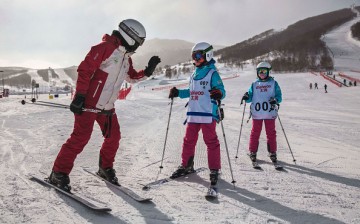 Tourists head to Chongli over the Lunar New Year holiday to try their hands at skiing.