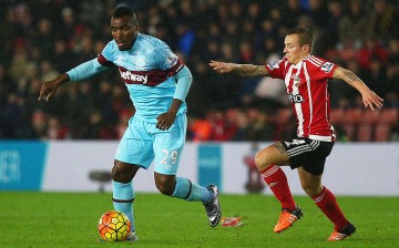 West Ham striker Emmanuel Emenike competes for the ball against Southampton's Jordy Clasie.