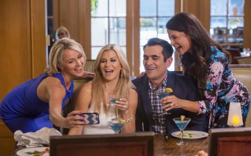 Phil (Ty Burrell) hangs out with the other housewives in 
