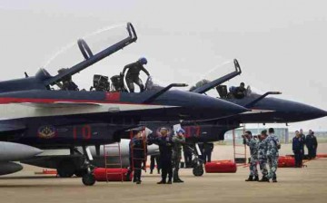 Pilots climb out of J-10 fighter jets after an exhibition during the China International Aviation & Aerospace Exhibition in Zhuhai, Guangdong Province, in Nov. 2014.