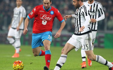 Napoli striker Gonzalo Higuaín (in red shirt) in action against Juventus.