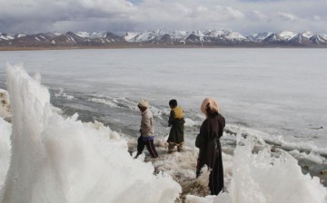 Tibetan Children Play On Frozen Namtso Lake