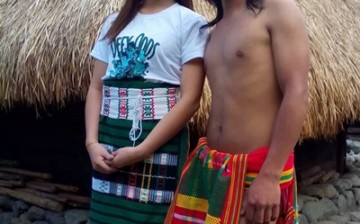 Wearing ethnic Igorot attires, Miss Mountain Province 2015 Shella Tudlong and Jeyrick Sigmaton, dubbed the Carrot Man, visit a nipa hut in Bontoc, Mountain Province.