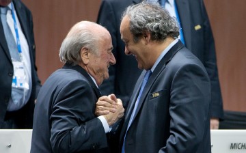 FIFA President Joseph S. Blatter (L) shakes hands with UEFA president Michel Platini during the 65th FIFA Congress at Hallenstadion on May 29, 2015 in Zurich, Switzerland.