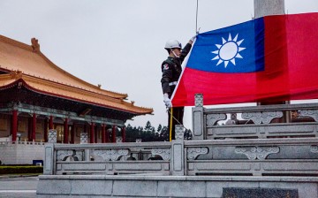 Honor guards prepare to raise the Taiwan flag in the Chiang Kai-shek Memorial Hall square in Taipei, Taiwan, on Jan. 14, 2016. 