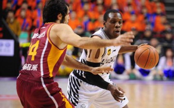 Liaoning Flying Tigers's Lester Hudson drives past a Guangdong Southern Tigers defender during Game 4 of their best-of-five semifinals series. Liaoning won, 105-96, to advance in the Finals against the Sichuan Blue Whales.