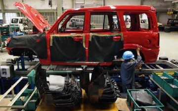 India-based automaker Mahindra plans to have its cars manufactured in China and put on hold its U.S. expansion plan.