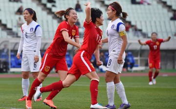 Wang Shanshan celebrates China's lone goal against South Korea.