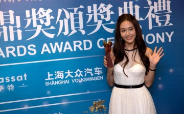 South Korean singer Jessica Jung poses after the 2013 Huading Awards Ceremony at The Venetian in Macau.
