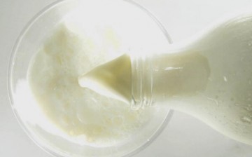 Milk being poured to a glass.