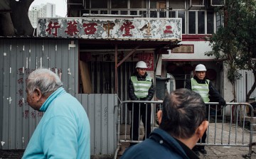City council officials seal up Nga Tsin Wai Village for demolition as part of a city re-urbanization plan in Wong Tai Sin District in Hong Kong on Jan. 26, 2016.