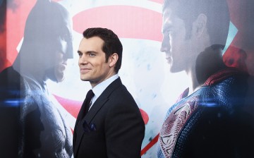 Henry Cavill posing during the red carpet premiere of 