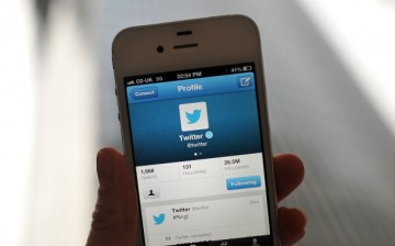 In this photo illustration, the Twitter logo and hashtag '#Ring!' is displayed on a mobile device as the company announced its initial public offering and debut on the New York Stock Exchange.