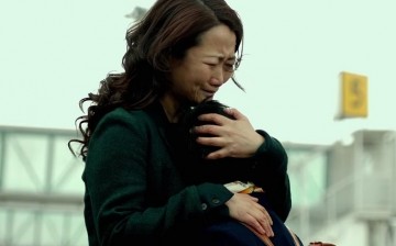 Mountains may depart but never a mother’s love: Zhao Tao, who lost a custody battle, embraces her son who will live with his father in Australia in Jia Zhangke’s 2015 drama, “Mountains May Depart.”