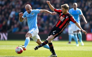 Bournemouth midfielder Eunan O'Kane competes for the ball against Manchester City's Pablo Zabaleta.