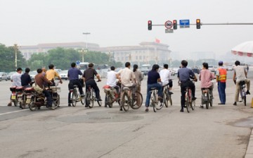 Two wheels will do: Traditional bikes, motorcycles and electronic bikes or e-bikes continue to be a favorite mode of transportation in China. 
