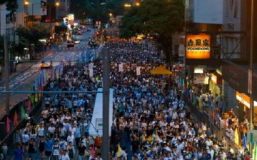 Protesters marched the streets to support the Hong Kong Rally for Democracy on July 1, 2014.