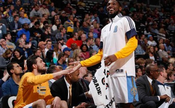 Danilo Gallinari and Kenneth Faried of the Denver Nuggets celebrate on the bench 