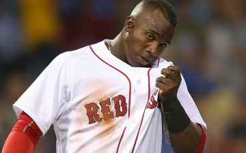  Rusney Castillo of the Boston Red Sox reacts after he was caught off third base.