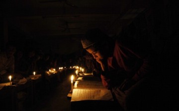 According to the World Bank, there are at least 1 billion people in the world who lack access to electricity. (Above) Candles accompany young students in Bangladesh, a South Asian country.