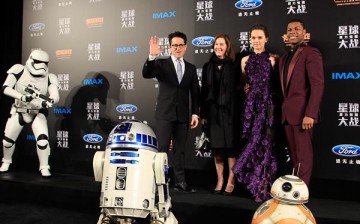 J.J. Abrams poses for a photo with Lucasfilm president Kathleen Kennedy and 