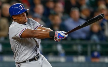 Adrian Beltre of the Texas Rangers hits an RBI single in the third inning against the Seattle Mariners. 