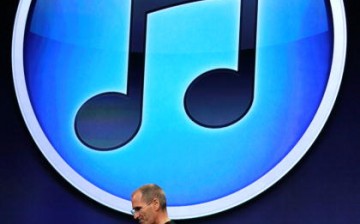 Apple CEO Steve Jobs stands in front of the new iTunes logo as speaks during an Apple Special Event at the Yerba Buena Center for the Arts Sept. 1, 2010 in San Francisco, California