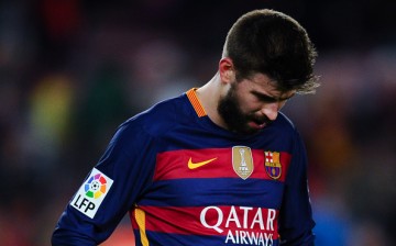 Gerard Pique of FC Barcelona leaves the pitch dejected. 