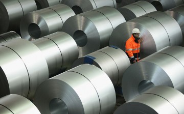 China has laid off hundreds of workers and closed several companies due to overcapacity in the steel industry.
