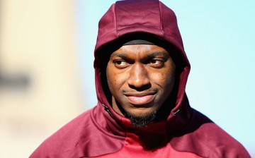 Robert Griffin III of the Washington Redskins looks on before the game against the New England Patriots.