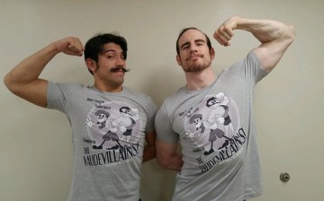 Simon Gotch and Aiden English posing with their new The Vaudevillains merchandise. 