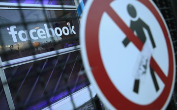 A no entry symbol hangs on an opened gate next to the Facebook logo at the Facebook Innovation Hub on February 24, 2016 in Berlin, Germany.   