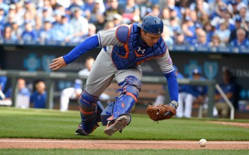 Travis d'Arnaud of the New York Mets chases down a foul ball.