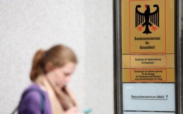 A pedestrian was seen walking while texting near the federal health ministry in Berlin, Germany.