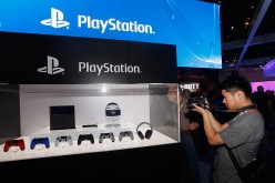 A game enthusiast takes photos of the Sony PlayStation 4, not the PlayStation NEO, and peripherals