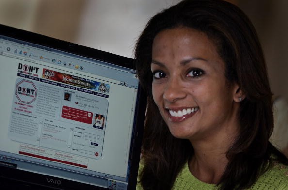 Tasha Joseph, the creator of the Don'tDateHimGirl.com website is pictured showing the site that permits women to post warning to other women about men cheating.